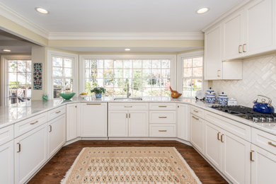 Cool White Cabinetry and Whimsical Windows in Large Kitchen