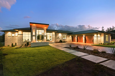 Mid-sized trendy beige one-story stone exterior home photo in Austin