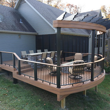 Custom curved, multilevel deck with bar and firepit - Innsbrook, MO
