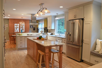 Eat-in kitchen - large transitional u-shaped porcelain tile eat-in kitchen idea in Boston with a single-bowl sink, shaker cabinets, gray cabinets, granite countertops, gray backsplash, mosaic tile backsplash, stainless steel appliances and an island