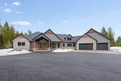 Large arts and crafts gray two-story wood and board and batten house exterior photo in Other with a gray roof