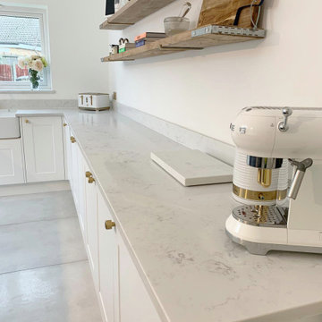 Traditional Kitchen with Navy Blue Island and White Natural Stone Effect Worktop
