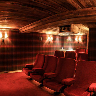 Mid-sized mountain style enclosed carpeted home theater photo in Grenoble with multicolored walls and a projector screen
