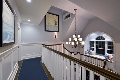 Inspiration for a large timeless carpeted and blue floor hallway remodel in New York with blue walls