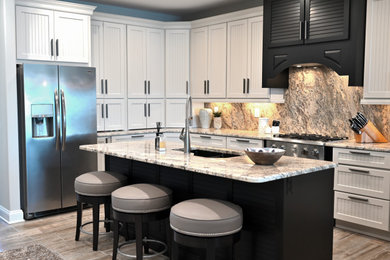 Large minimalist porcelain tile eat-in kitchen photo in Other with beaded inset cabinets, beige cabinets, granite countertops and granite backsplash