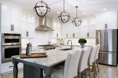 Mid-sized transitional l-shaped porcelain tile and beige floor open concept kitchen photo in Toronto with an undermount sink, shaker cabinets, white cabinets, quartz countertops, white backsplash, porcelain backsplash, stainless steel appliances and an island