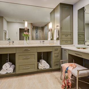 Mid-sized transitional master beige tile porcelain floor and beige floor corner shower photo in Jacksonville with recessed-panel cabinets, green cabinets, gray walls, an undermount sink, terrazzo countertops, a hinged shower door and beige countertops