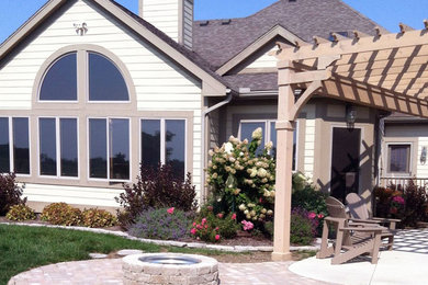 Mid-sized traditional beige one-story wood house exterior idea in San Diego with a hip roof and a shingle roof