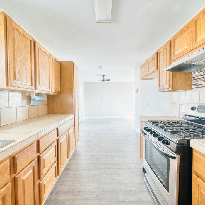 A kitchen with hanging drawers
