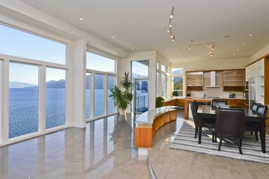 Inspiration for a mid-sized contemporary porcelain tile kitchen/dining room combo remodel in Other with white walls