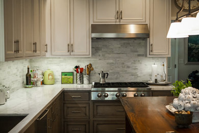 Eat-in kitchen - mid-sized country galley medium tone wood floor eat-in kitchen idea in San Francisco with an undermount sink, beaded inset cabinets, gray cabinets, marble countertops, gray backsplash, stone tile backsplash, stainless steel appliances and an island