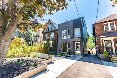 This is an example of a small modern partial sun front yard concrete paver landscaping in Toronto for summer.