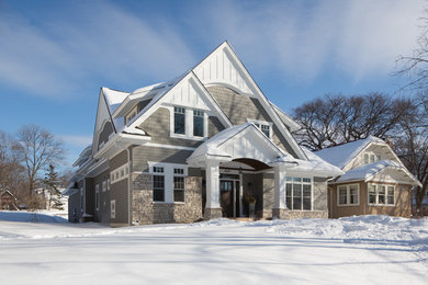 Large elegant gray two-story mixed siding exterior home photo in Minneapolis