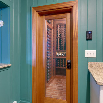 Secret passageway wine cellar. Basement layout with all mahogany racking.
