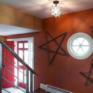 This is an example of a mid-sized eclectic foyer in Richmond with orange walls, medium hardwood floors, a single front door and a red front door.