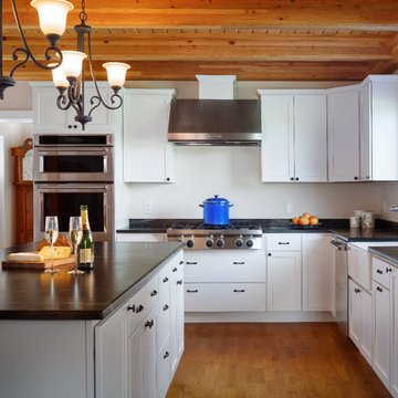 A clean, crisp, modern kitchen easily welcomes guests.  Champagne anyone?