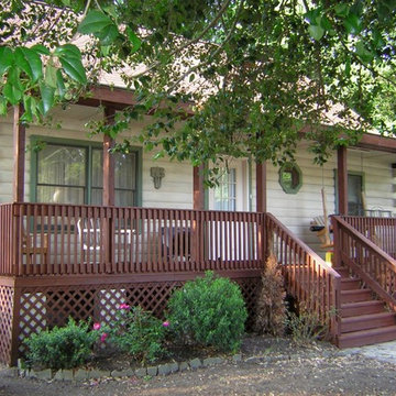 Rustic White, Green and Burgundy Wood Stain on a Log House in Cape May Point,