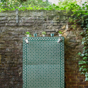 Tiled feature wall in tiny urban garden