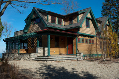 Mid-sized farmhouse brown two-story wood exterior home idea in Chicago with a shingle roof