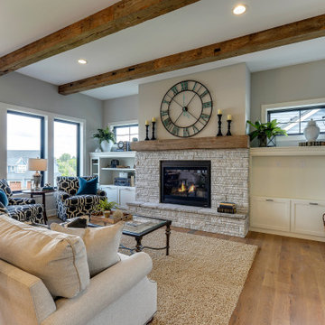 Hand Hewn Wood Mantel and Box Beams in a Contemporary Living Room