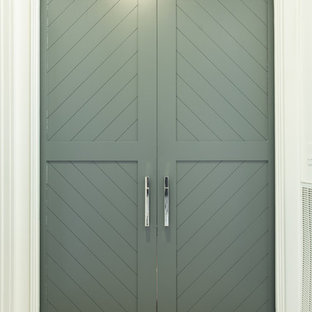 This is an example of a medium sized classic enclosed home cinema in Houston with grey walls, carpet, a built-in media unit and beige floors.