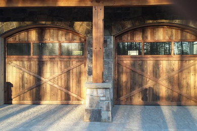 Garage - mid-sized rustic attached two-car garage idea in Other