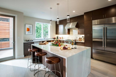 Design ideas for a mid-sized contemporary l-shaped eat-in kitchen in Orlando with an undermount sink, flat-panel cabinets, brown cabinets, marble benchtops, white splashback, stone slab splashback, stainless steel appliances, light hardwood floors, with island, beige floor and white benchtop.