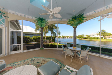 Island style patio photo in Miami