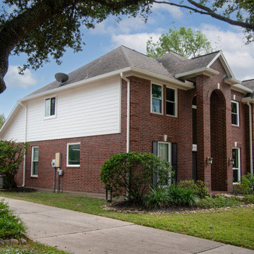 Re-side and gutters of mid-90's 2 story house in Houston, TX