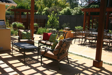 Design ideas for a large traditional backyard patio in San Francisco with decking and a pergola.