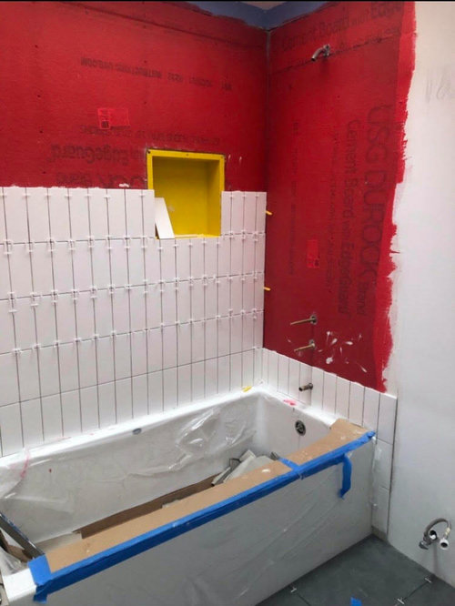 Tiles on the bathroom wall keep cracking