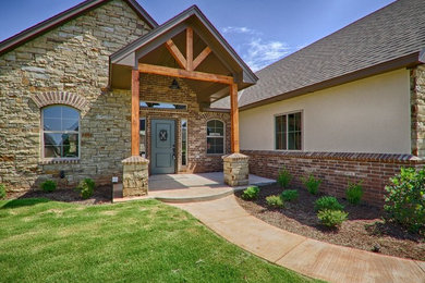 Traditional one-story brick gable roof idea in Oklahoma City
