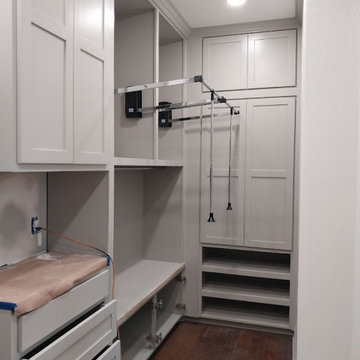 Custom Walk-In Closet with Pull-Down Wardrobe Racks & Built-In Vanity/Dresser