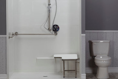 Inspiration for a mid-sized contemporary gray tile linoleum floor and gray floor bathroom remodel in Toronto with a two-piece toilet and gray walls