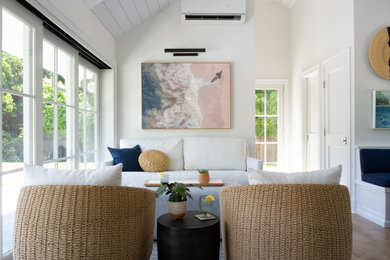 Beach style living room photo in New York