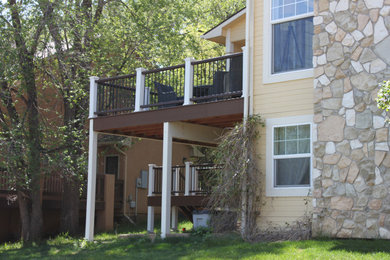 Example of a large classic backyard deck design in Denver