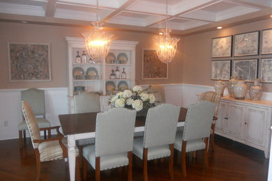 This is an example of a mid-sized country separate dining room in New York with beige walls, dark hardwood floors, no fireplace and brown floor.