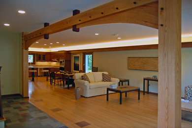 Inspiration for a large contemporary formal and open concept light wood floor and brown floor living room remodel in Cleveland with beige walls, no fireplace and no tv