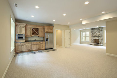 Basement - large rustic look-out carpeted and beige floor basement idea in Calgary with beige walls, a standard fireplace and a stone fireplace