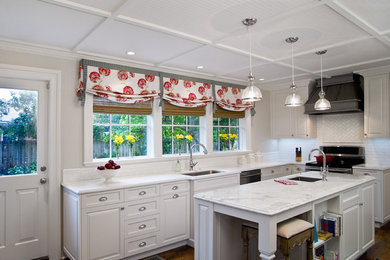 Mid-sized transitional l-shaped separate kitchen in Jacksonville with an undermount sink, raised-panel cabinets, white cabinets, marble benchtops, white splashback, subway tile splashback, stainless steel appliances, dark hardwood floors, with island and brown floor.