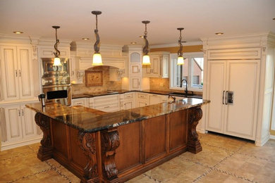Inspiration for a modern kitchen remodel in Nashville with an undermount sink, white cabinets, granite countertops and an island