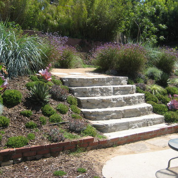 Broken concrete from the old patio was repurposed and used to make steps to the