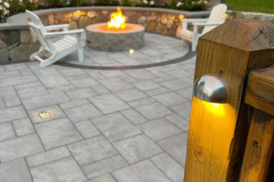Outdoor living space with sitting wall and fire feature
