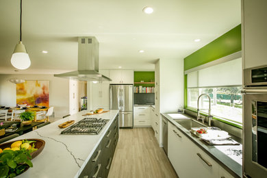 Inspiration for a mid-sized modern l-shaped porcelain tile and beige floor eat-in kitchen remodel with an undermount sink, flat-panel cabinets, white cabinets, quartz countertops, gray backsplash, quartz backsplash, stainless steel appliances, an island and white countertops