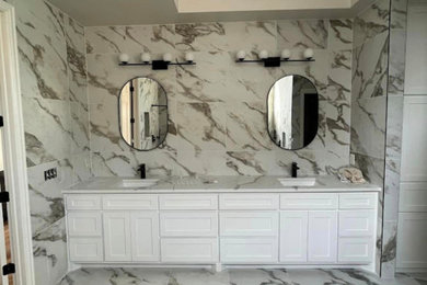 Example of a huge master multicolored tile and marble tile marble floor, multicolored floor, double-sink and vaulted ceiling bathroom design in Dallas with shaker cabinets, white cabinets, a two-piece toilet, multicolored walls, a drop-in sink, granite countertops, multicolored countertops and a built-in vanity