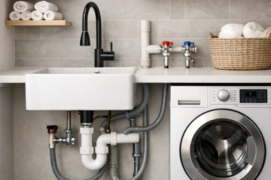 Inspiration for a contemporary laundry room remodel in Other