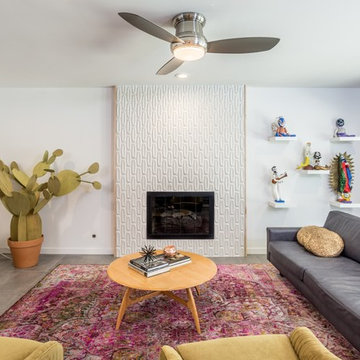 Living Room with Detailed Fireplace and Area Rug