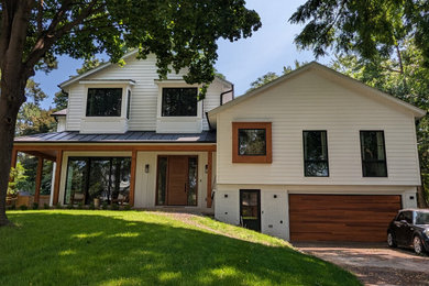 Example of a farmhouse exterior home design in Toronto