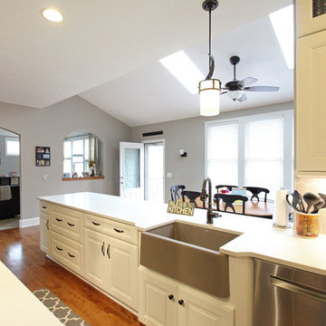 White Kitchen with Espresso Island and Eternia Caringdale Quartz Countertop