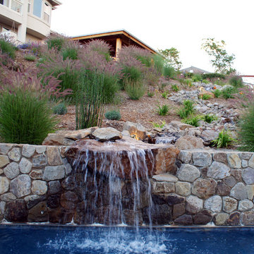 waterfall, stream, and hillside planting